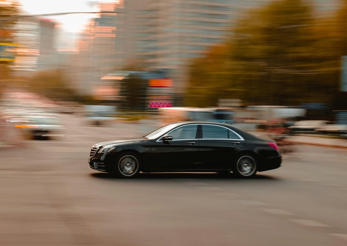 Black sedan on road